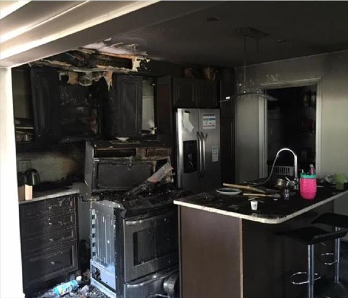 kitchen cabinets and appliances are burnt 