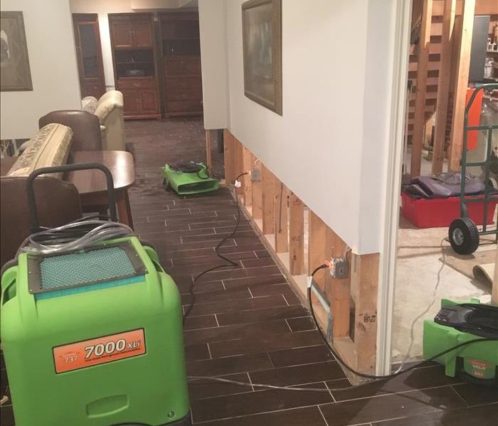Basement tile floor, SERVPRO drying equipment and drywall removed at 2 feet 