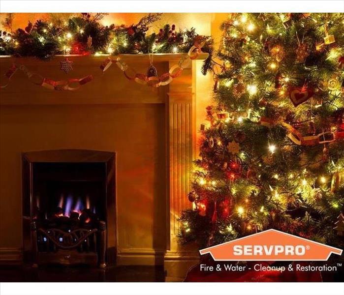 Picture of a Christmas Tree and Fireplace with a SERVPRO logo in right corner